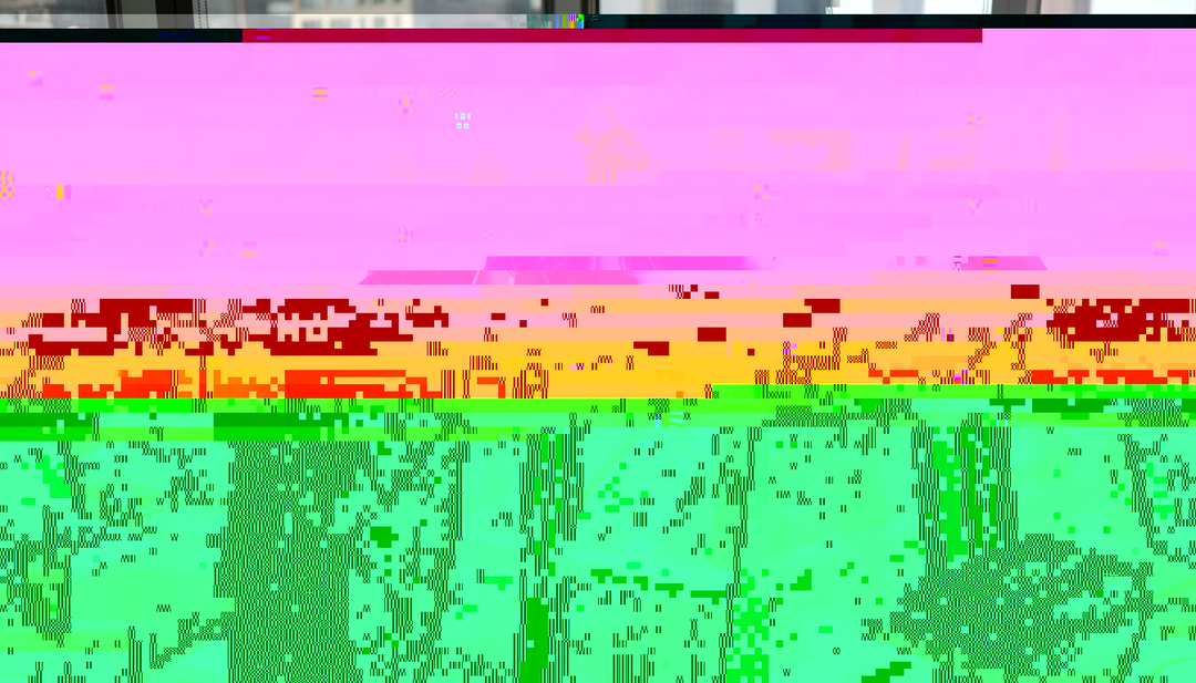 Woman styling statement coat in office