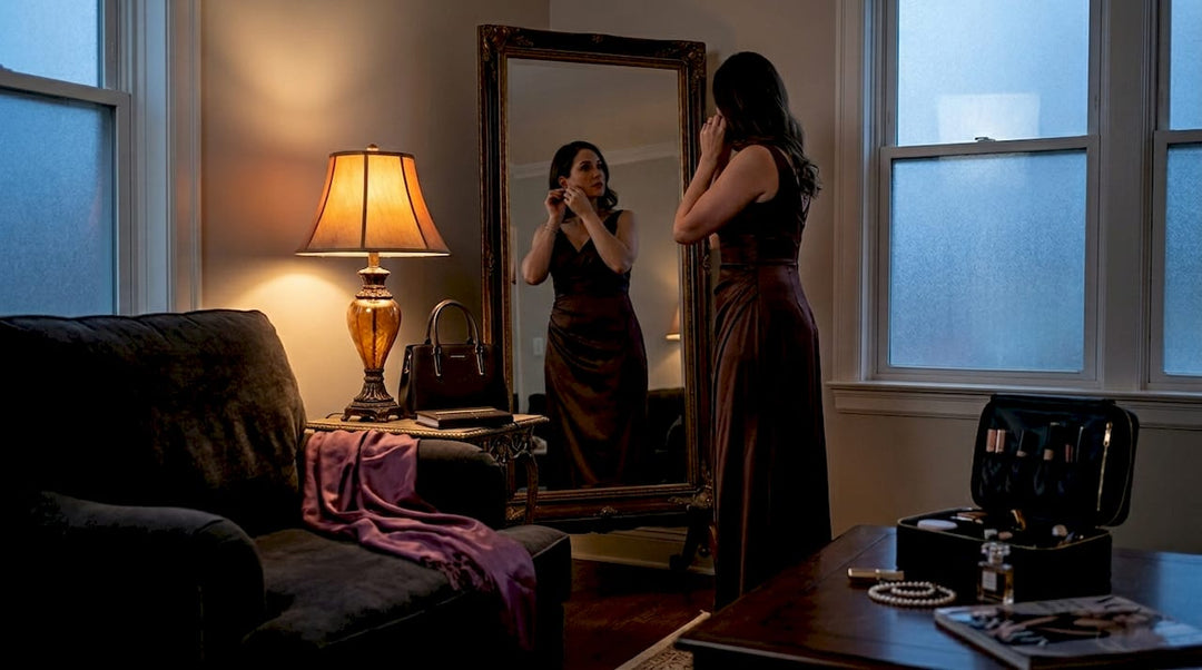 Woman preparing in elegant gown at home