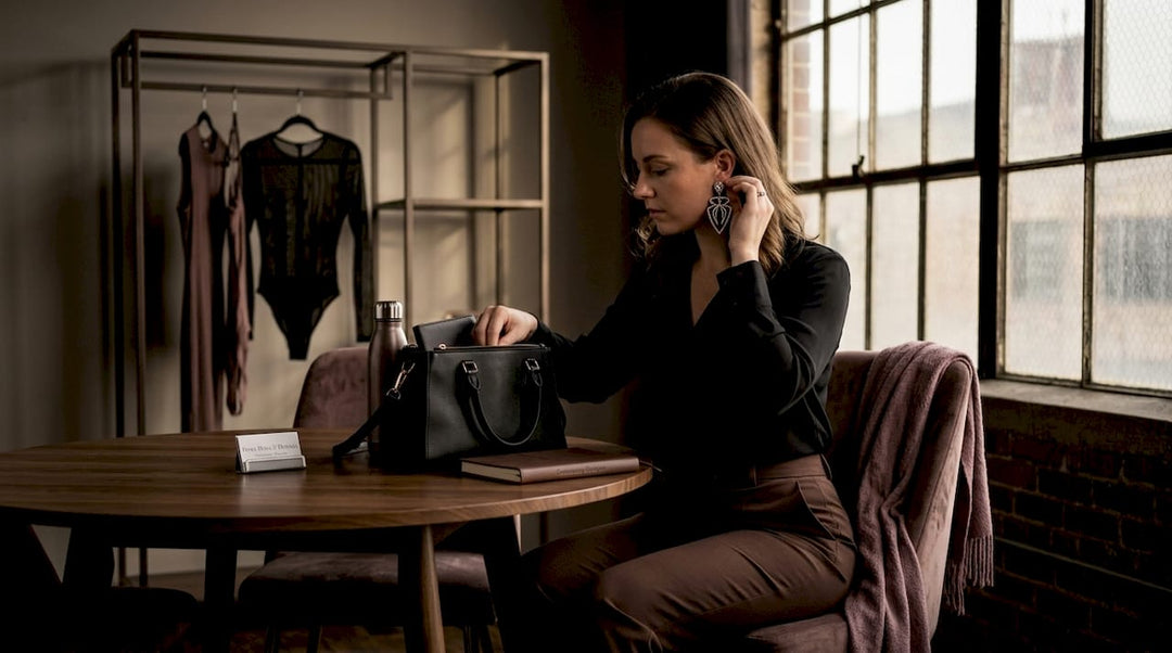 Woman adding bold accessories at café