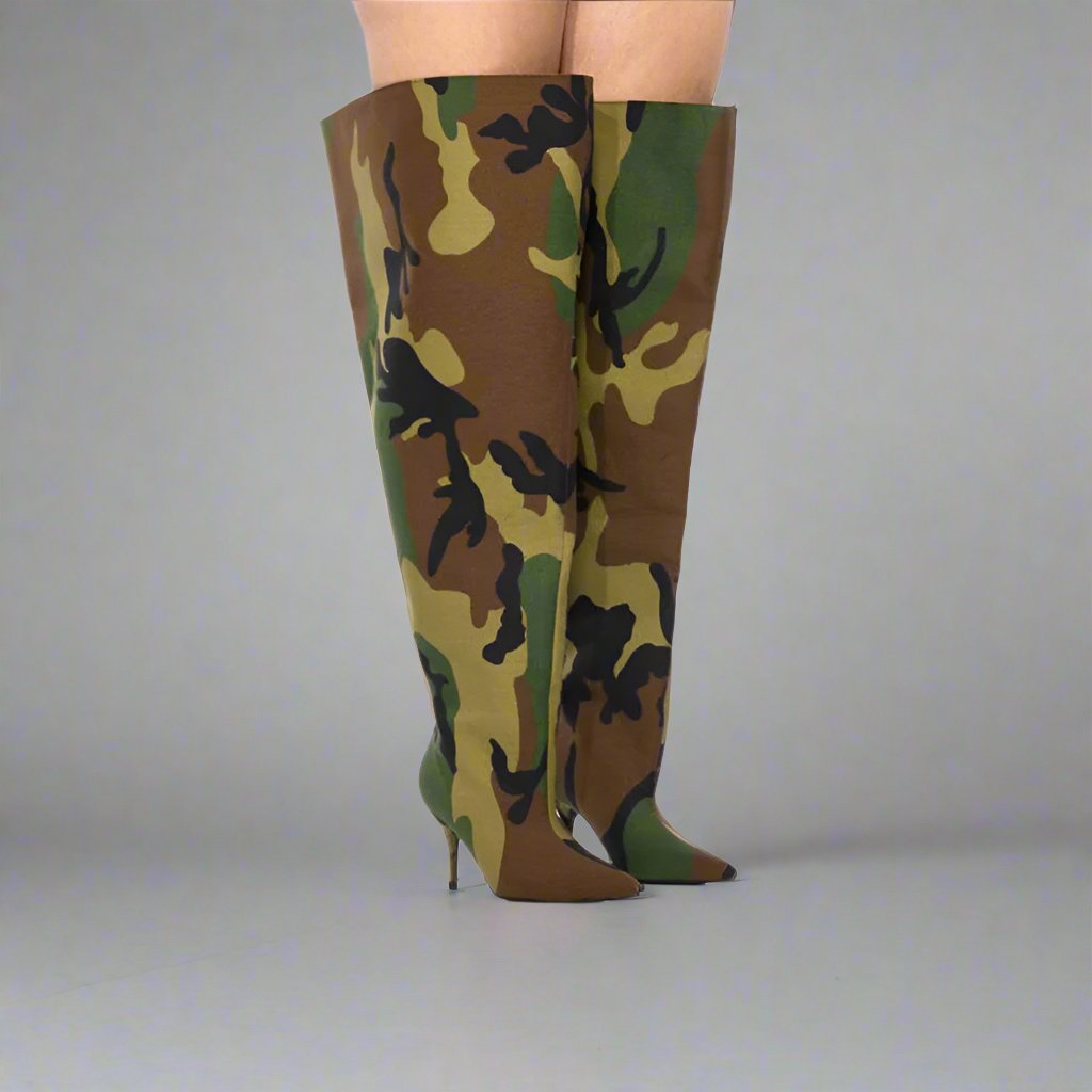 The ultimate in statement footwear, these boots feature an attention-grabbing camouflage pattern, an exaggerated thigh-high length, and a sleek stiletto heel.