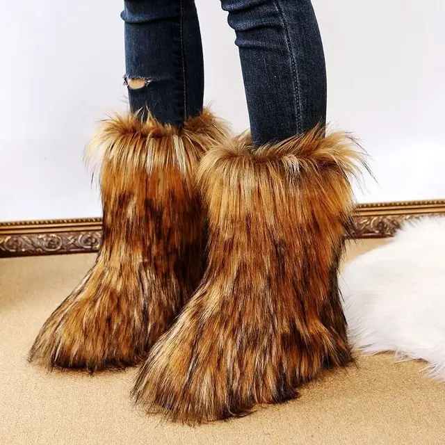 Chic and cozy calf-length flat boots crafted from plush, two-tone faux fur, perfect for winter style.