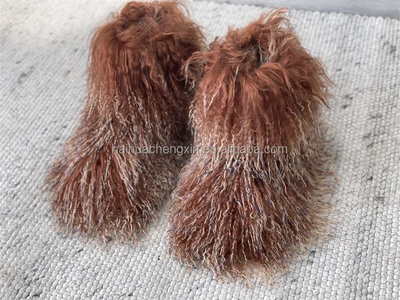 Luxurious, calf-high winter boots crafted from soft, textured Mongolian lamb fur in beige and brown