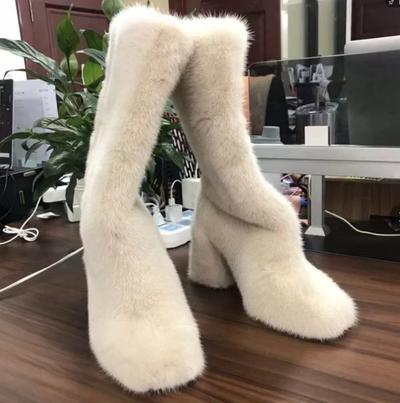 Elegant, knee-high winter boots crafted from plush, with white mink fur 