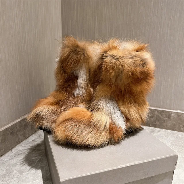 Eye-catching ankle boots crafted from plush, multicolored fox fur, perfect for making a statement in winter.