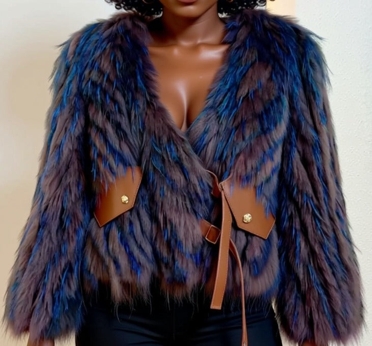 A close-up image of a woman wearing a blue and purple fur coat with a brown leather belt detail.