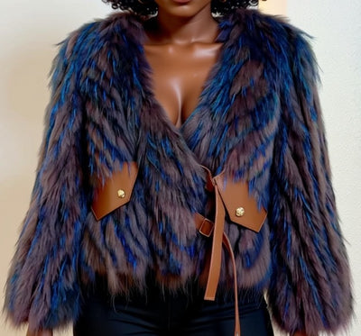 A close-up image of a woman wearing a blue and purple fur coat with a brown leather belt detail.