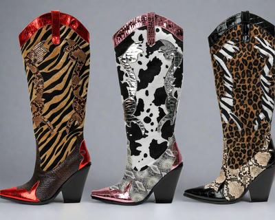 Detailed view of three pairs of tall cowboy boots with pointed toes and block heels, each featuring a different animal print combination: zebra/snakeskin, cowhide/metallic, and leopard/snakeskin